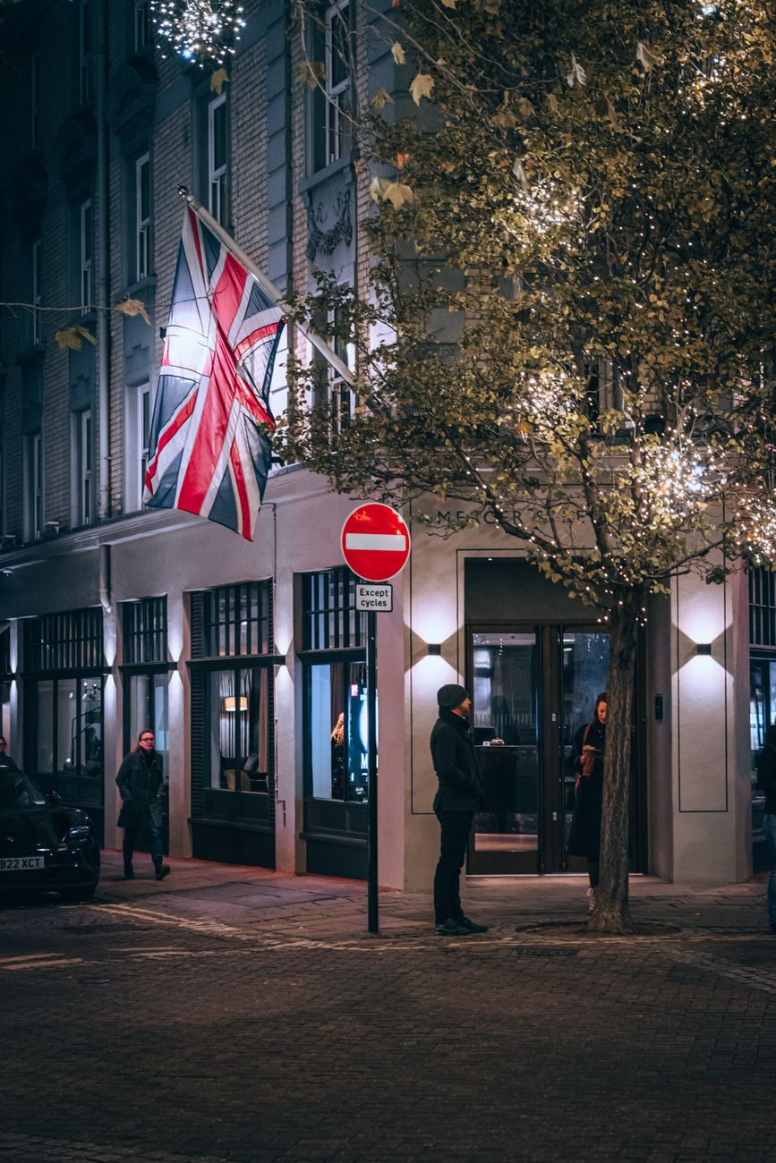 uk flag on a street at night